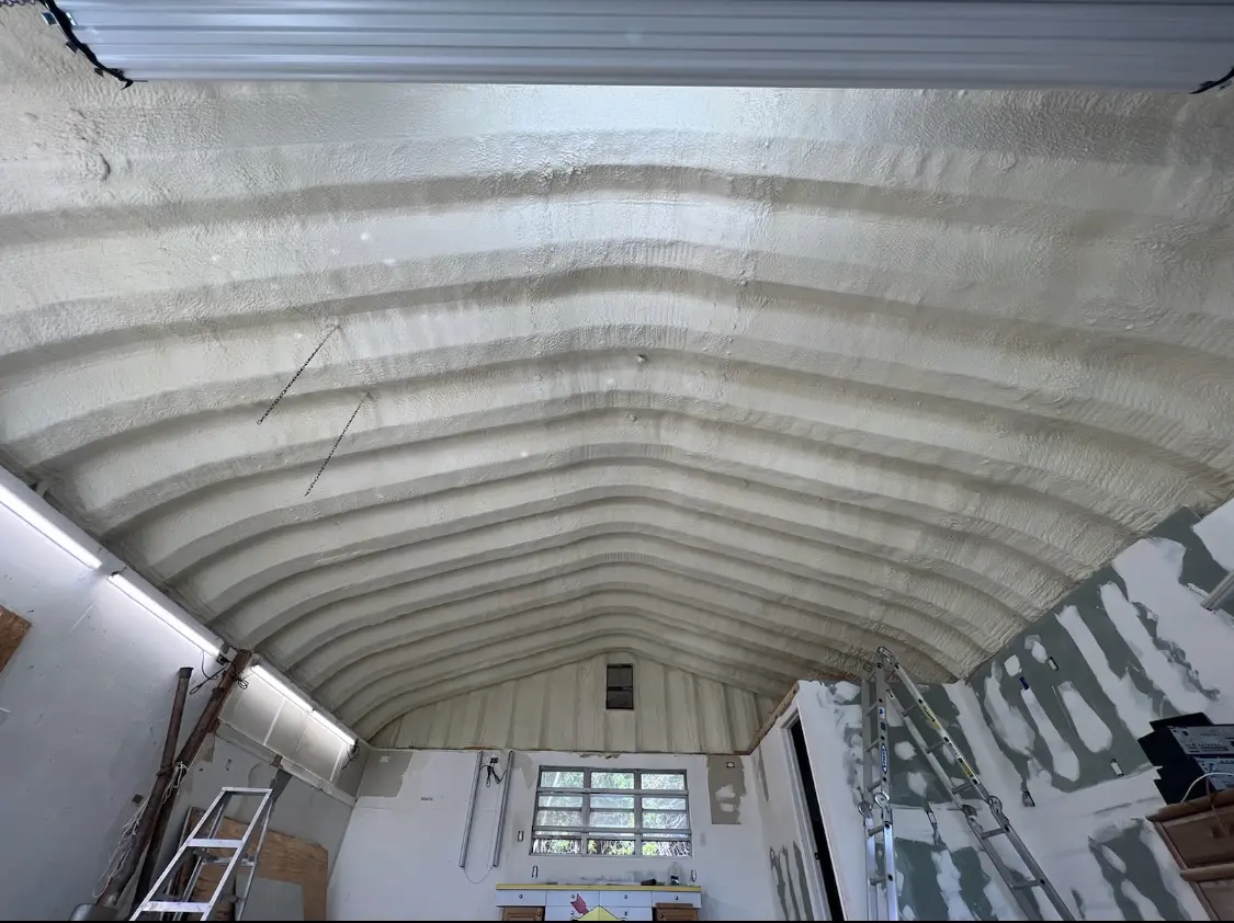 Spray polyurethane foam applied to the underside of a metal roof deck in Lafayette